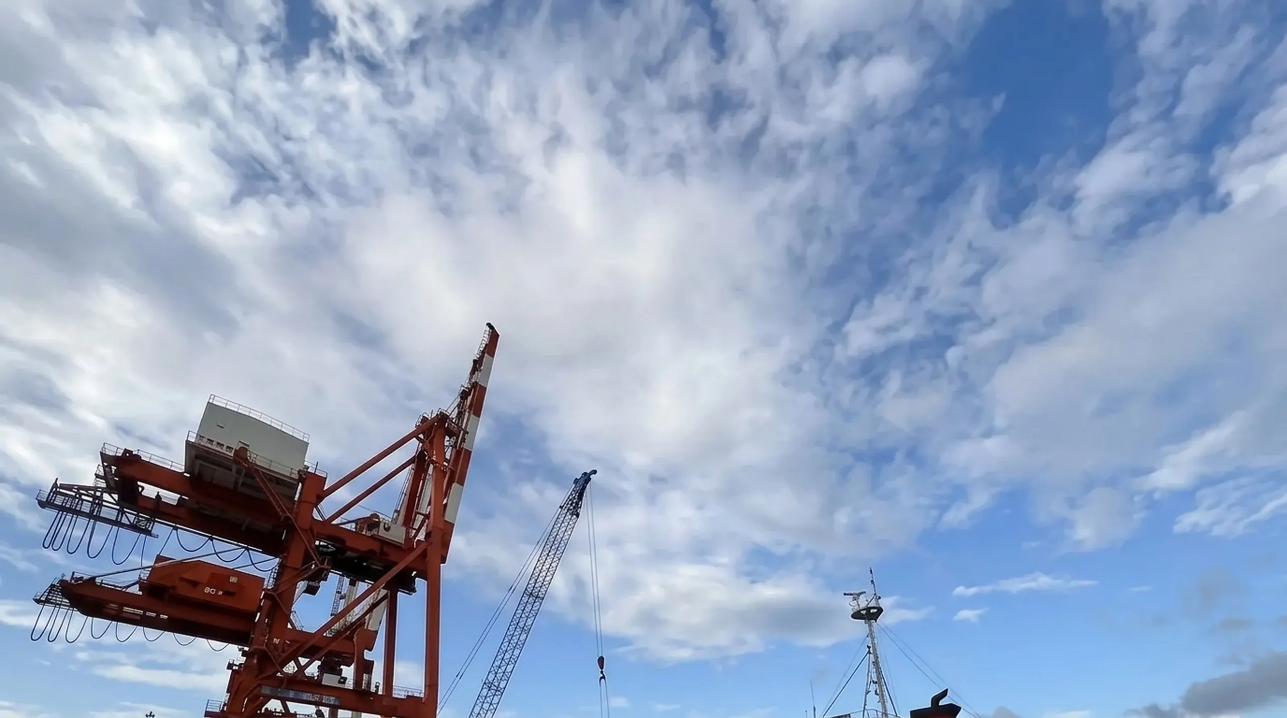 Quay cranes loading a ship at a port